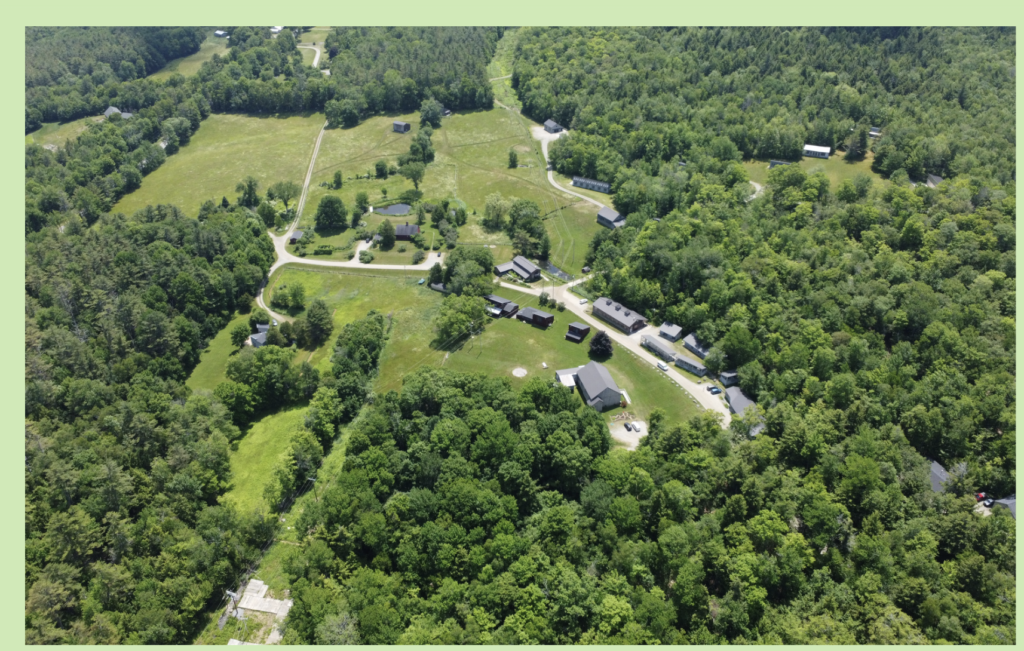 Skowhegan School of Painting and Sculpture campus in rural Maine showing artist residency buildings and woodland landscape