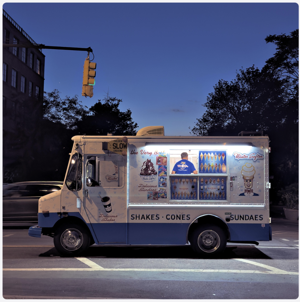 icecream truck on a road in the US in the blue hour