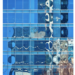 photograph of a tall building with water reflected into the front