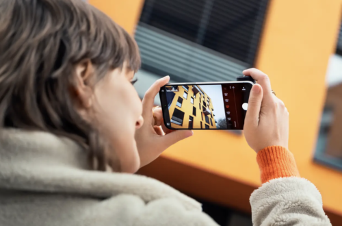 photograph a woman taking a photo with the Leica Pro app