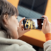 photograph a woman taking a photo with the Leica Pro app