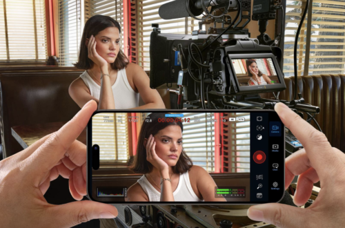 Blackmagic Camera app on iPhone used alongside a professional cinema camera for high-quality mobile filmmaking.