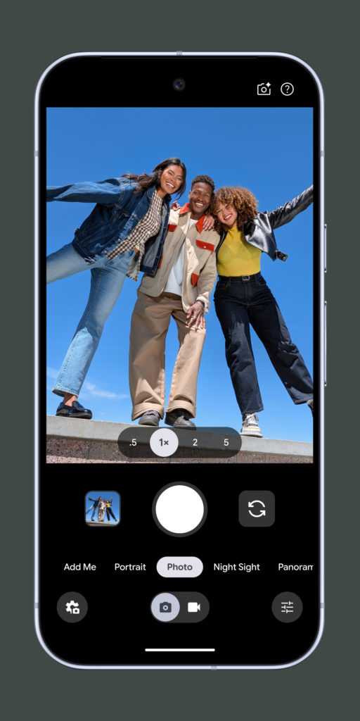 Screenshot of the Google Pixel Camera app interface on a Pixel smartphone showing Photo mode with a group portrait, zoom controls, Night Sight, Portrait mode and Google's AI-powered mobile photography features.